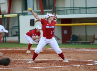 Softball starts season with split series
